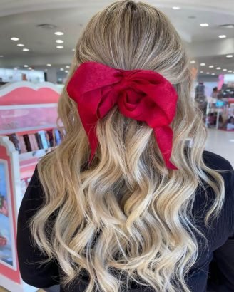 Christmas Inspired Hairstyles and Colors Beach Waves Half Up Large Red Bow