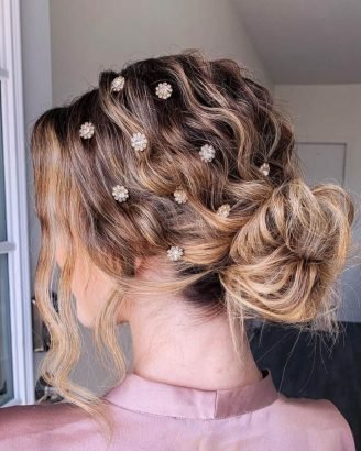 Christmas Inspired Hairstyles and Colors Curled Low Bun and Accessories