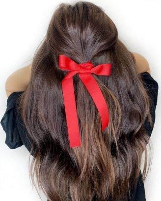 Christmas Inspired Hairstyles and Colors Half Up Bright Red Bow