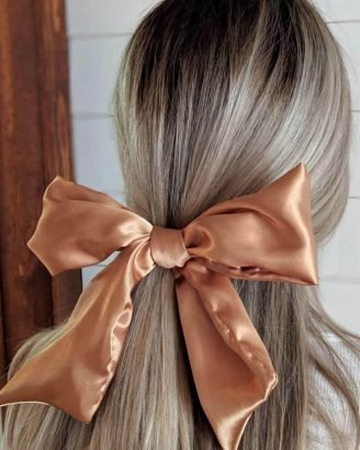 Christmas Inspired Hairstyles and Colors Half Up Large Satin Bow
