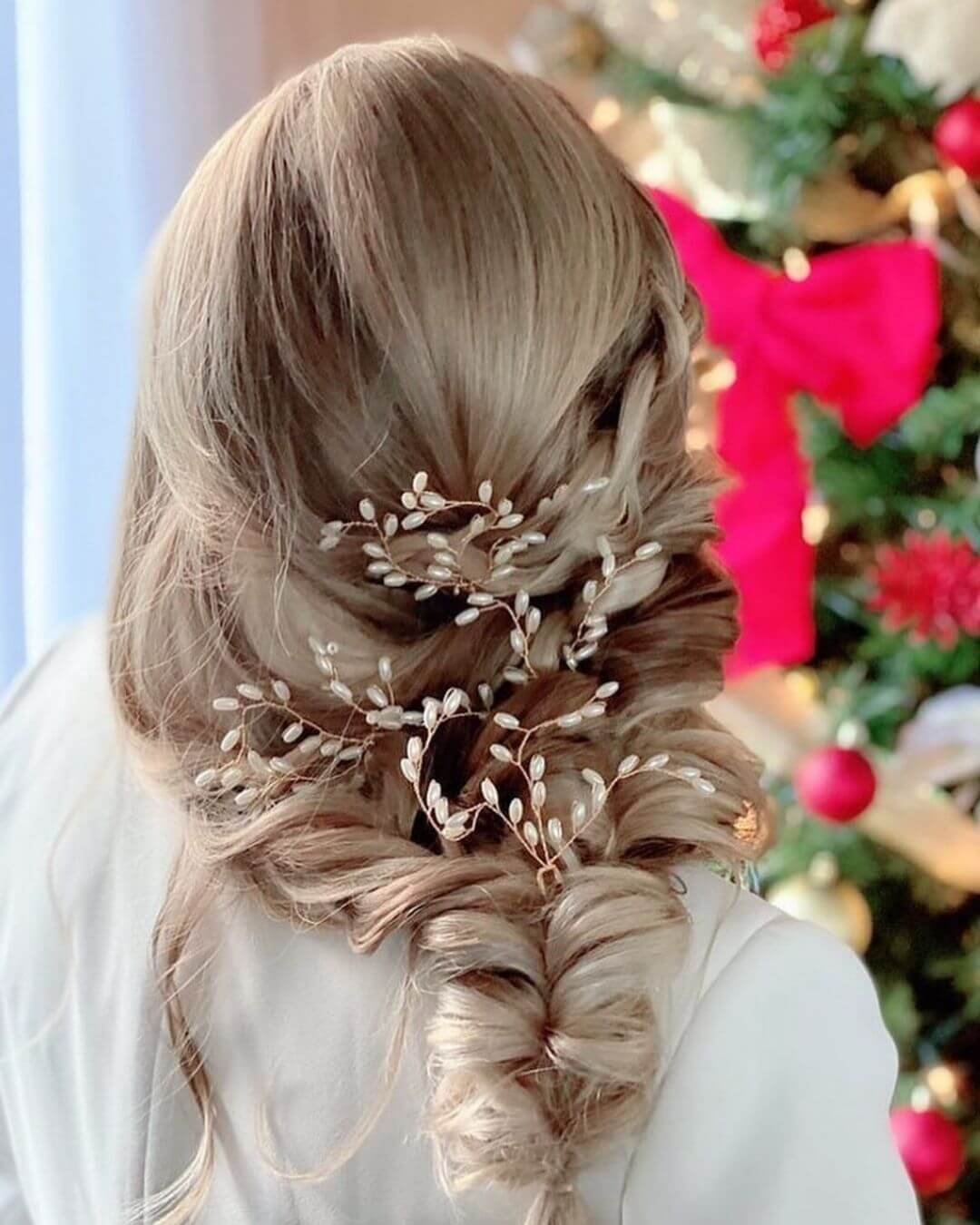Christmas Inspired Hairstyles and Colors Loose Fishtail Braid Long Blonde Hair