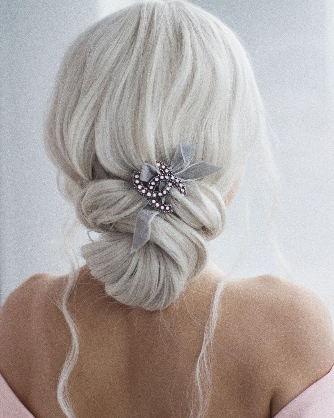 Christmas Inspired Hairstyles and Colors White Blonde Low Bun